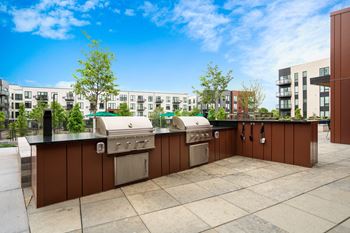 Outdoor kitchen with gas grills